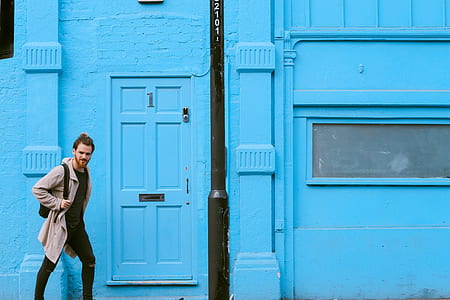 man walking beside building at daytime thumbnail