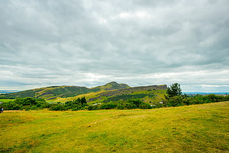 landscape photography of hills surrounded by trees thumbnail