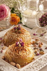 baked pastry with nuts in white plate thumbnail