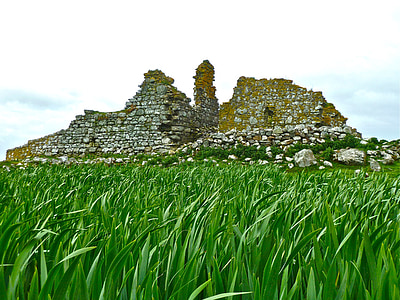 stone ruins and grass field thumbnail