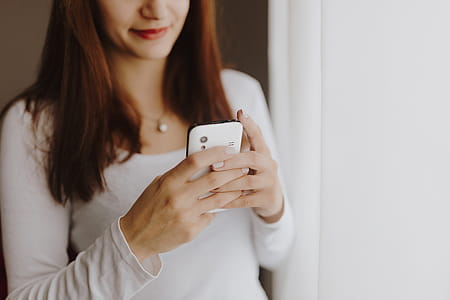 Beautiful young woman using smartphone thumbnail