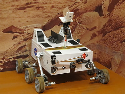 white robot on brown table thumbnail