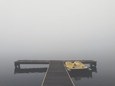 yellow boat near dock thumbnail