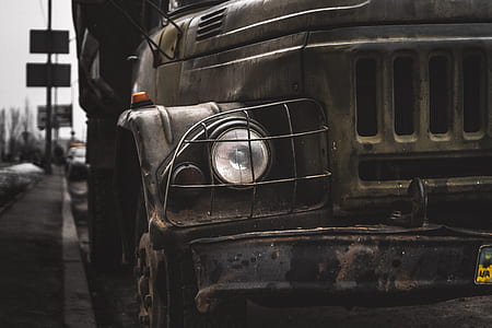 brown vehicle parked beside curb thumbnail