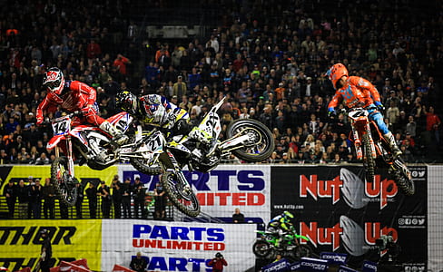 men riding motocross dirt bikes thumbnail
