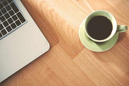 white ceramic mug on brown wooden surface thumbnail