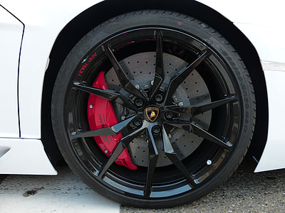 black Lamborghini multi-spoke wheel and tire thumbnail