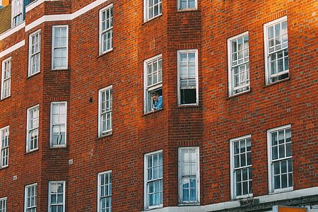 man looking out through the window thumbnail