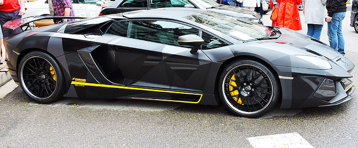 black Lamborghini Aventador parked near people thumbnail