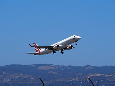 white airplane in flight thumbnail