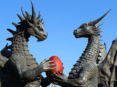 two dragon holding head statue thumbnail