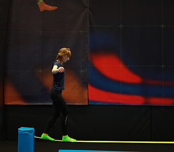 woman standing on green strap thumbnail