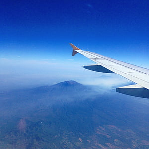 aerial photo of mountain under blue sky at daytime thumbnail