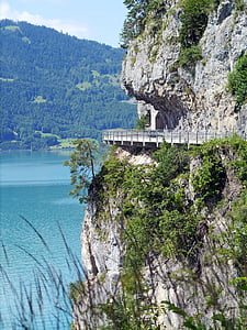 white hillside road with railings eye-level photography thumbnail
