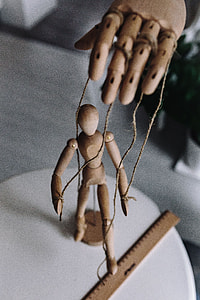 Wooden mannequin in various poses thumbnail