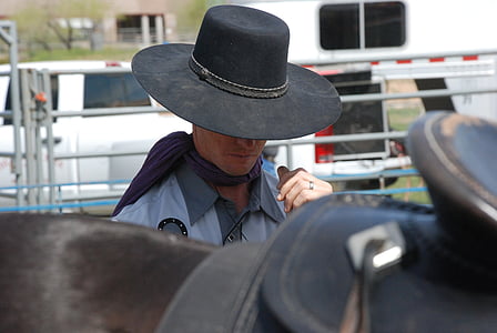 man standing near horse during daytime thumbnail
