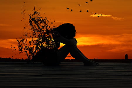 silhouette faded body of person during sunset thumbnail
