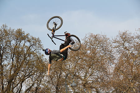 man riding on BMX during daytime thumbnail