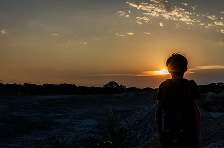 Silhouette of a Boy During Sunset thumbnail