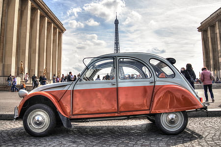people near white Volkswagen New Beetle thumbnail