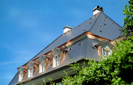 gray house surrounded by trees thumbnail