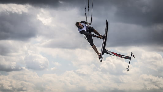 man with board in blue sky thumbnail