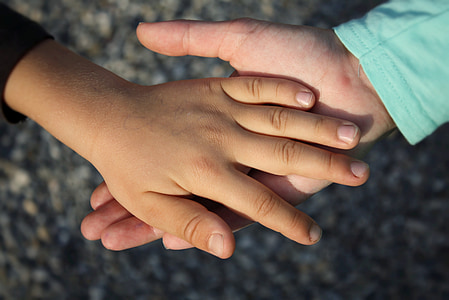 close up photo of toddler's hand thumbnail