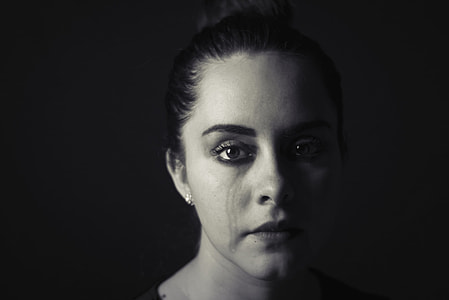 woman with teary eye thumbnail