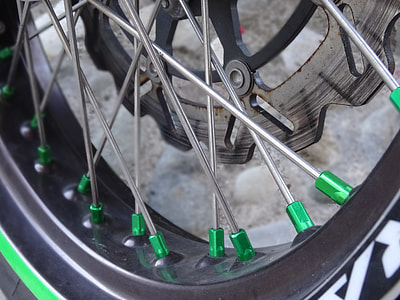 closeup photo of motorcycle rim with disc brake thumbnail