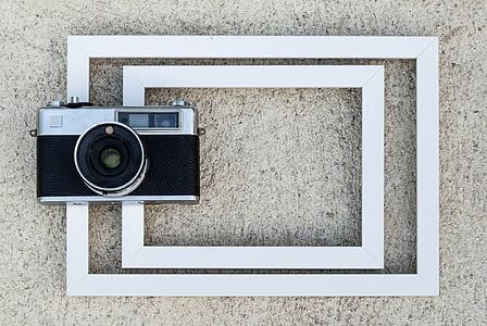 black and grey point-and-shoot camera thumbnail