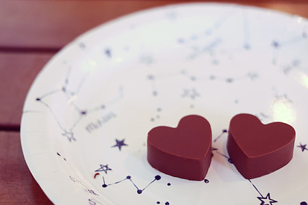 photo of two red heart-shaped pastries on plate thumbnail