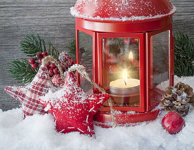 red tealight candle holder on snow flakes thumbnail