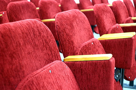 empty red fabric armchairs thumbnail