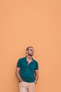 man wearing teal polo shirt and brown bottoms during daytime thumbnail