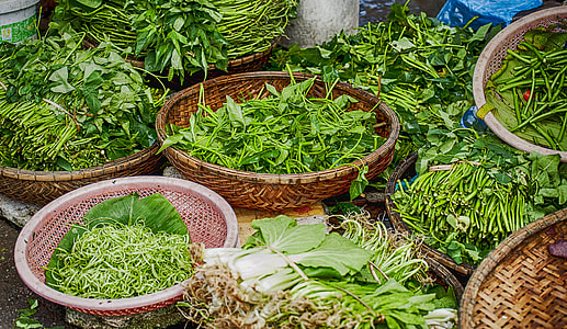brown baskets full of green leafy vegetables thumbnail