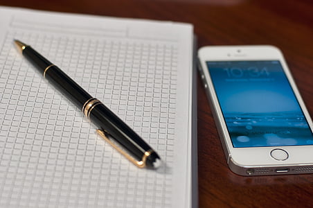 silver iPhone 5s beside twist pen thumbnail