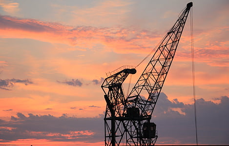 black metal crane at sunset thumbnail