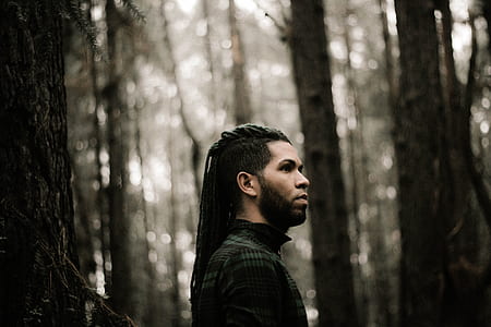man in black top in forest thumbnail
