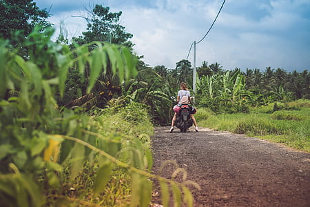 woman on motorcycle during daytime thumbnail