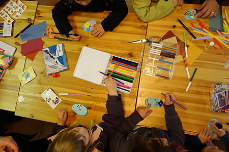 children holding coloring pens thumbnail