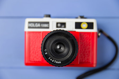 Overhead shot of a red retro camera thumbnail