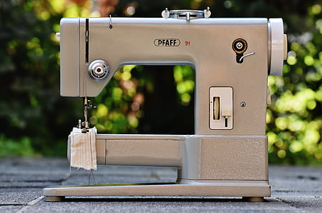 selective focus photography of electric sewing machine thumbnail