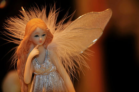 closeup photography of angel figurine thumbnail