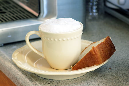 bread in plate beside cup of coffee thumbnail