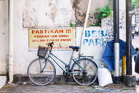 blue city bike on gray concrete ground thumbnail
