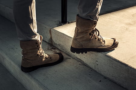person wearing brown boots thumbnail