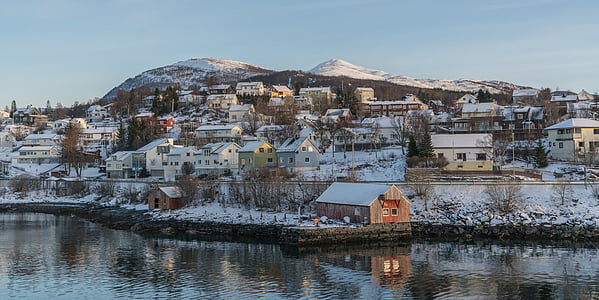 houses near body of water during twilight thumbnail