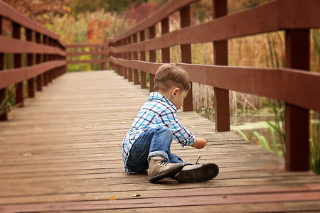 boy in white, teal, and black plaid dress shirt thumbnail