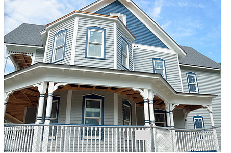 white, blue, and gray wooden house at daytime thumbnail