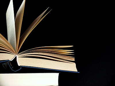 open book against black background thumbnail